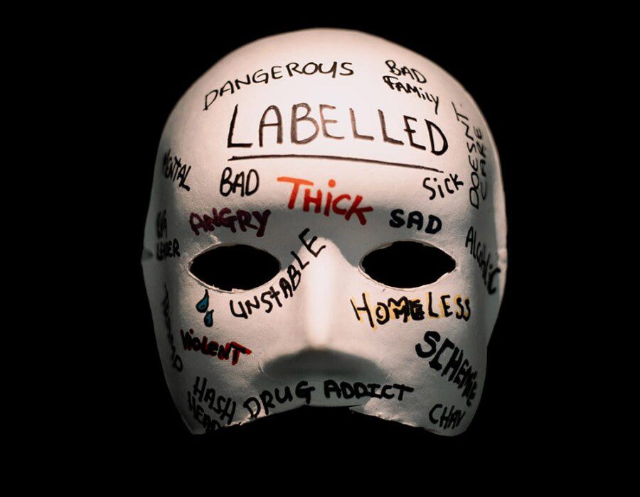 A mask with writing on it. There are words like 'Bad' and 'Thick'