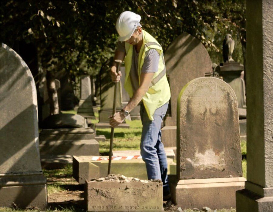 A person working in a graveyard